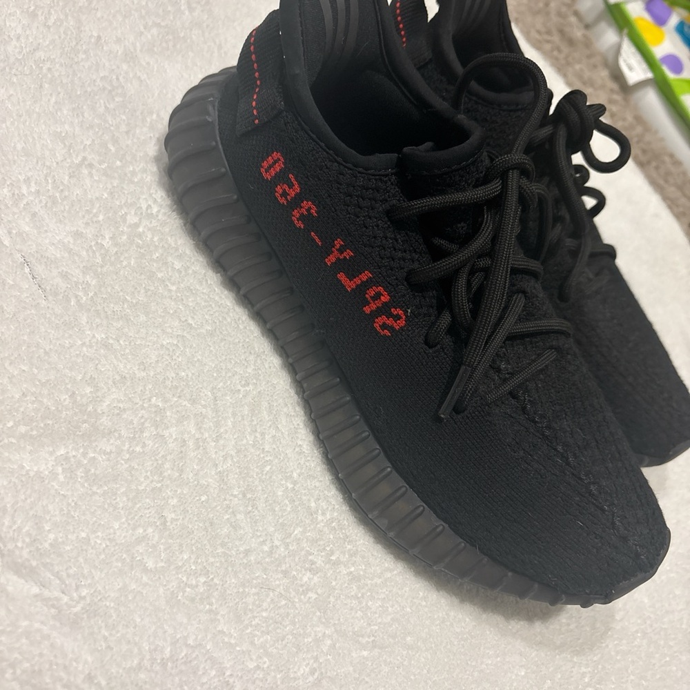 Yeezy Black and Red Athletic Shoes